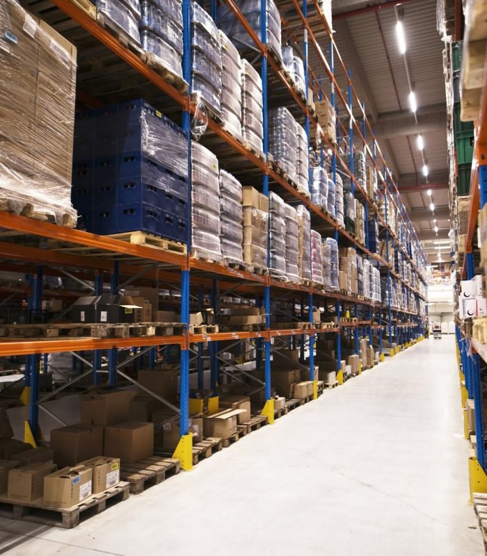 interior large distribution warehouse with shelves stacked with palettes goods ready market